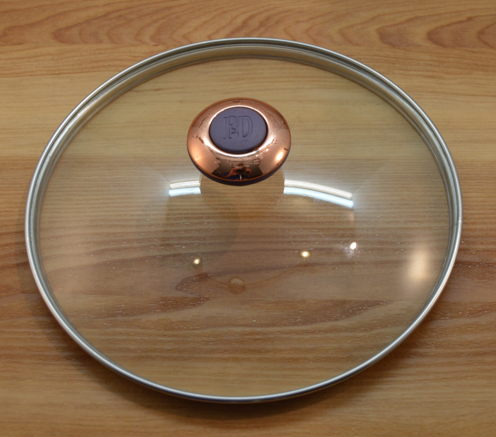 P D Glass Lid trimmed in Stainless. 9 7/8” Rim To Rim. 9 5/8”edge to edge. D5