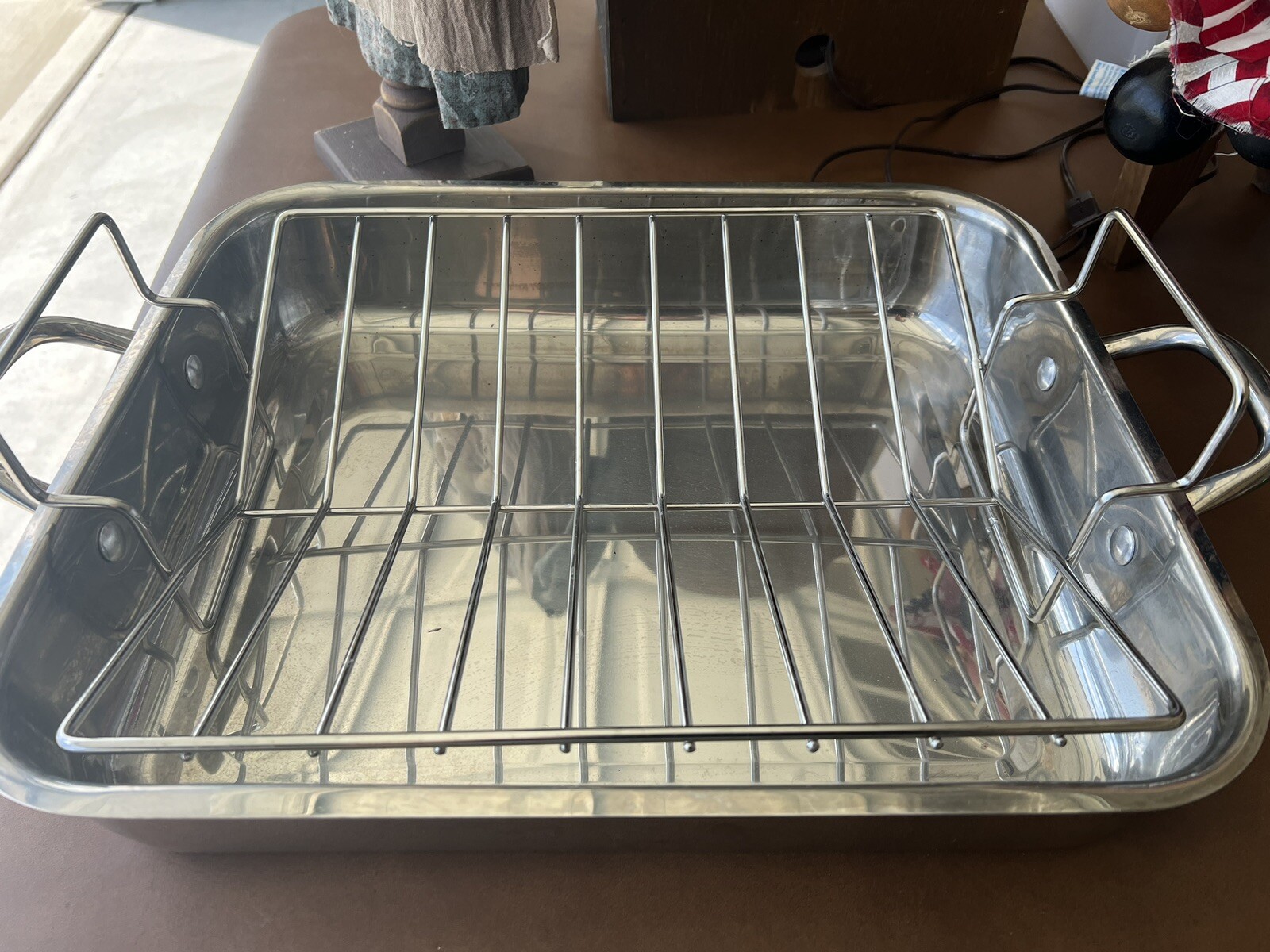 WOLFGANG PUCK Stainless Steel Roaster w/V Shaped Raised Rack 16.5 x 14 x 3″
