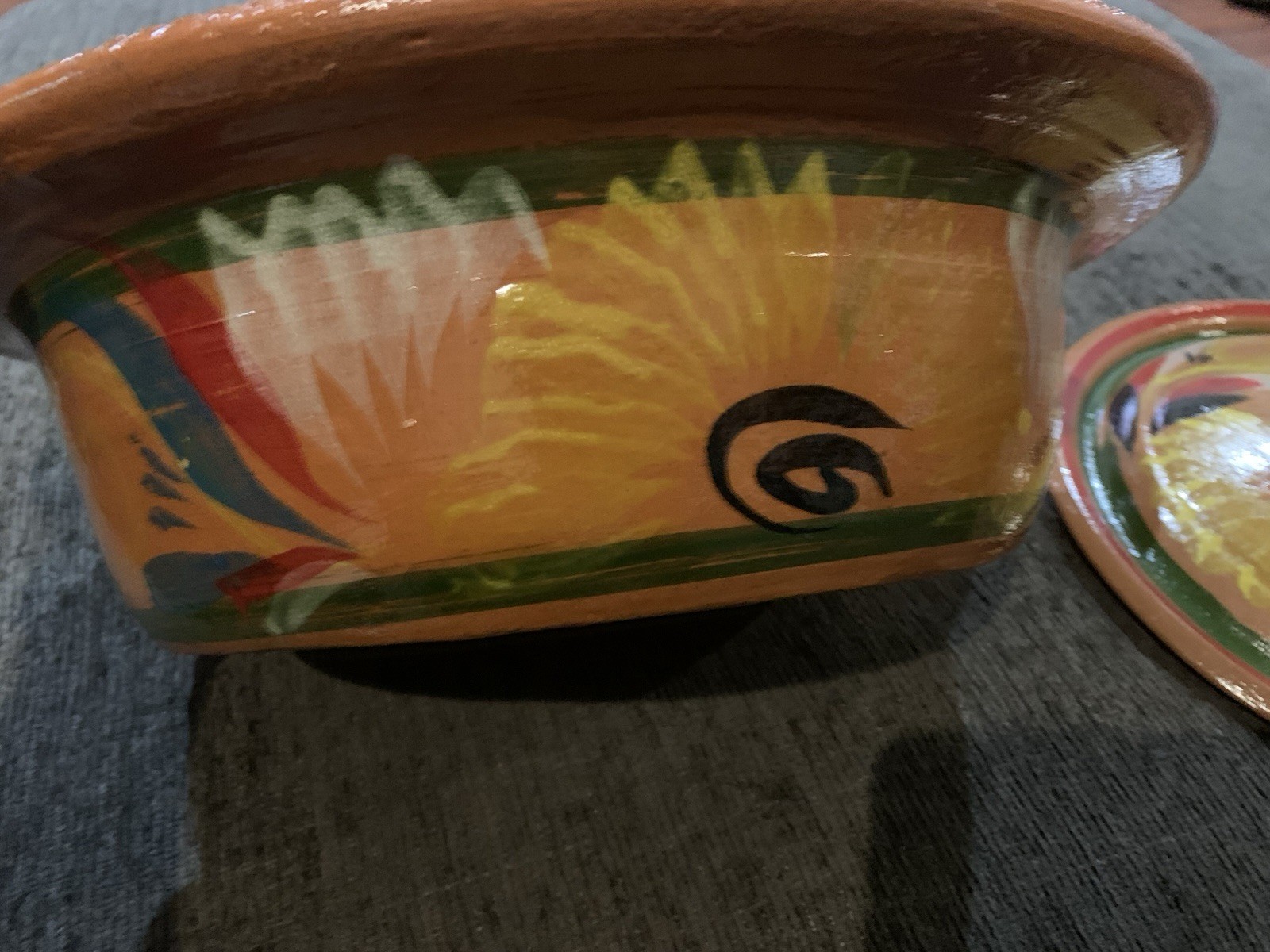 Traditional Mexican clay cazuela casserole dish feat hand-painted designs.