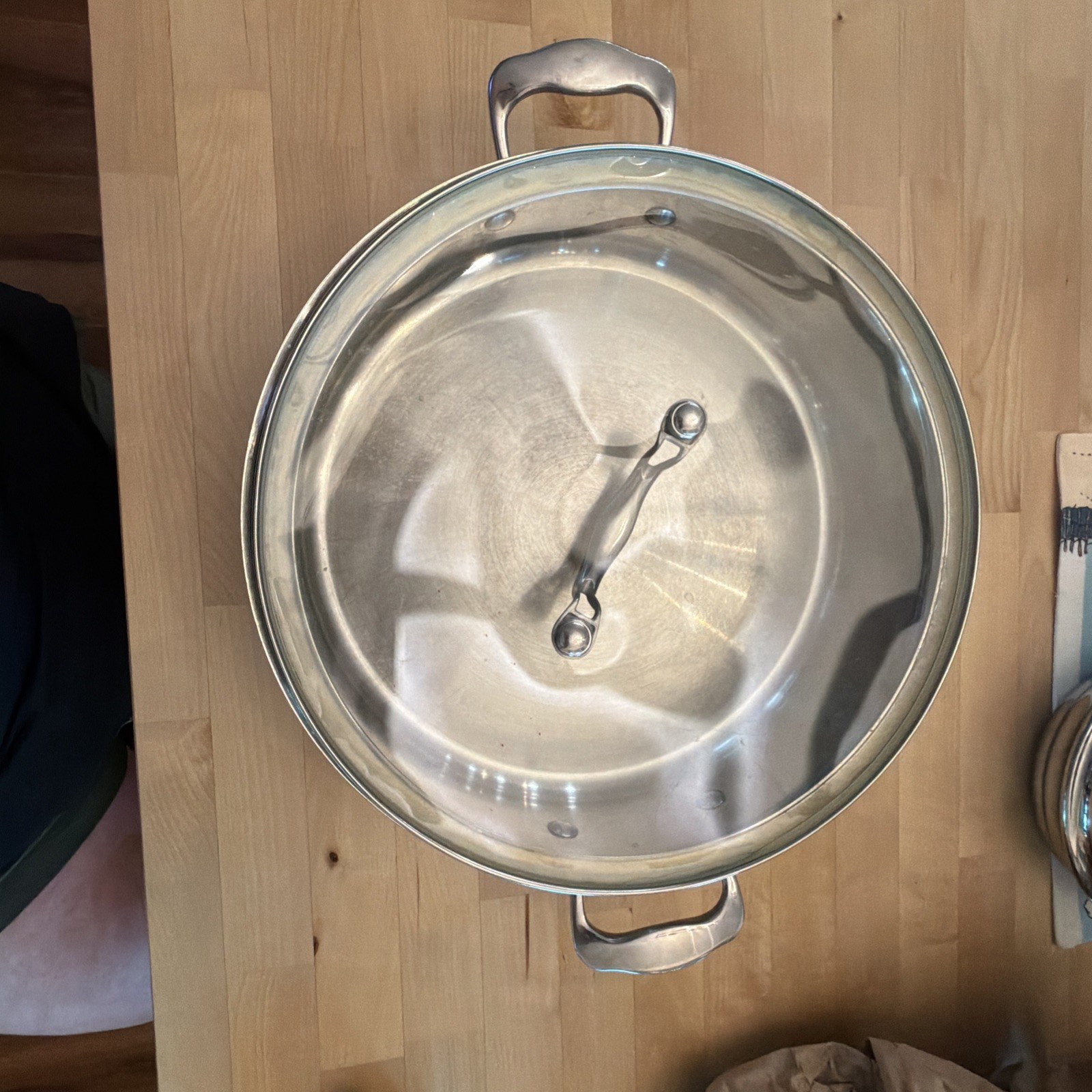 6.5 Qt. Braiser, featuring a large, stainless steel body with rounded sides.