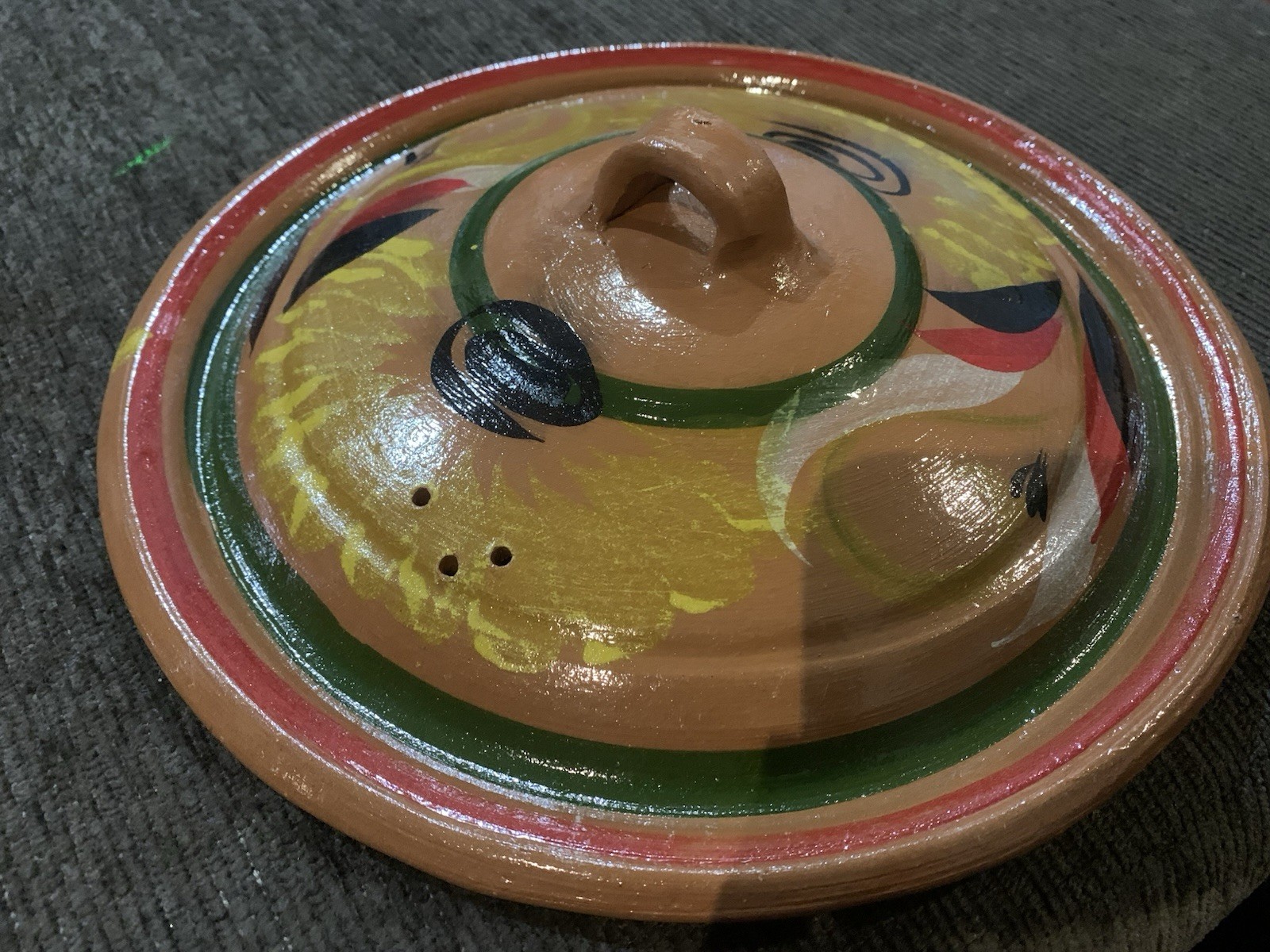 Traditional Mexican clay cazuela casserole dish feat hand-painted designs.