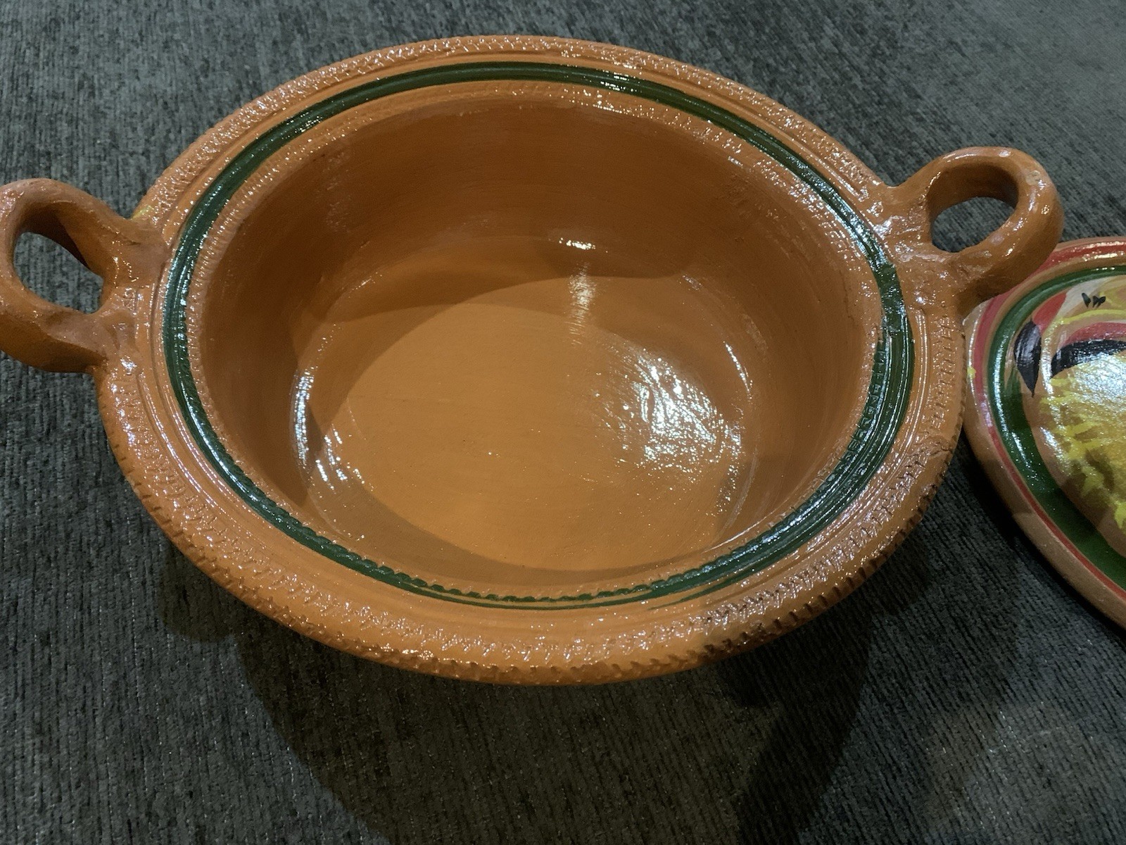 Traditional Mexican clay cazuela casserole dish feat hand-painted designs.