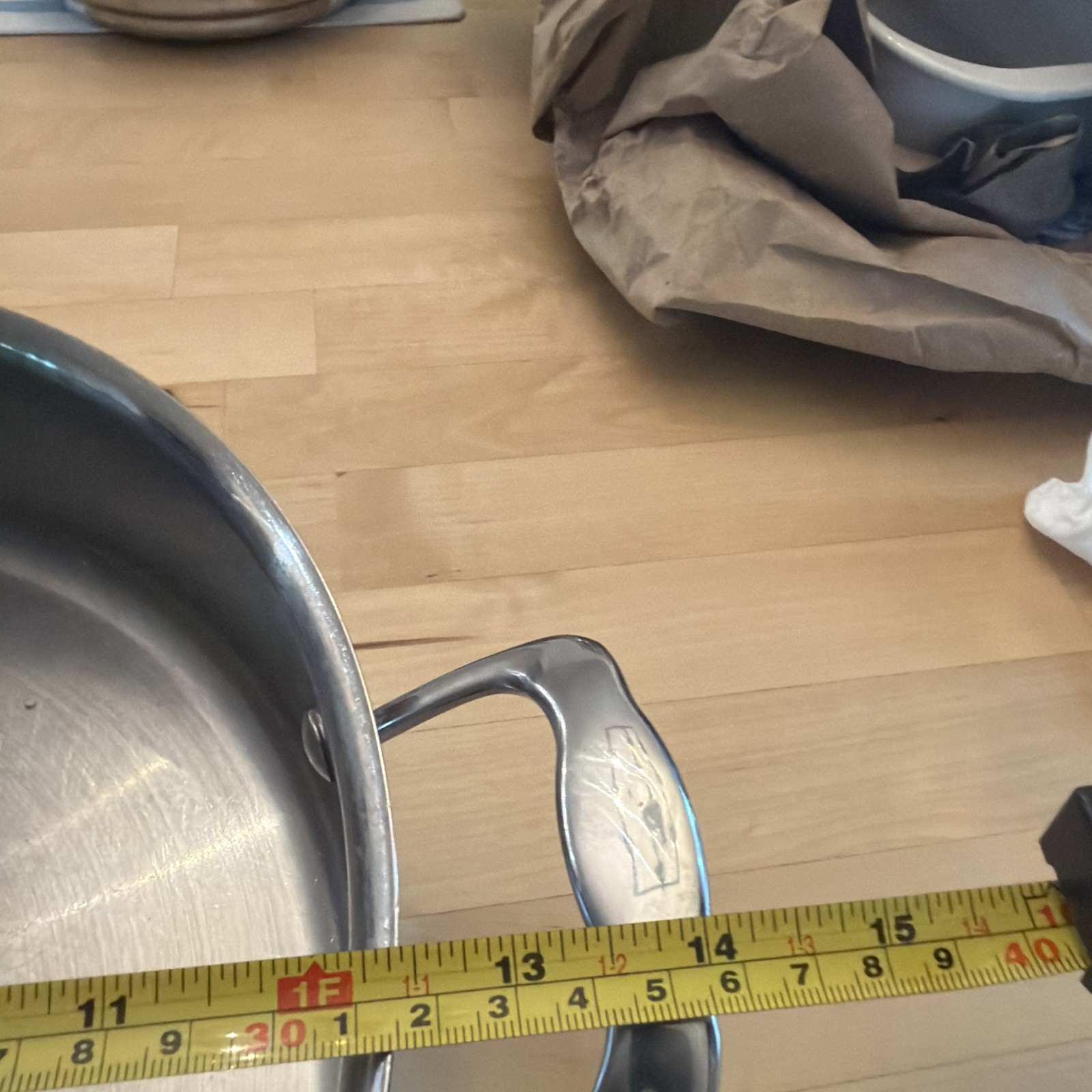 6.5 Qt. Braiser, featuring a large, stainless steel body with rounded sides.