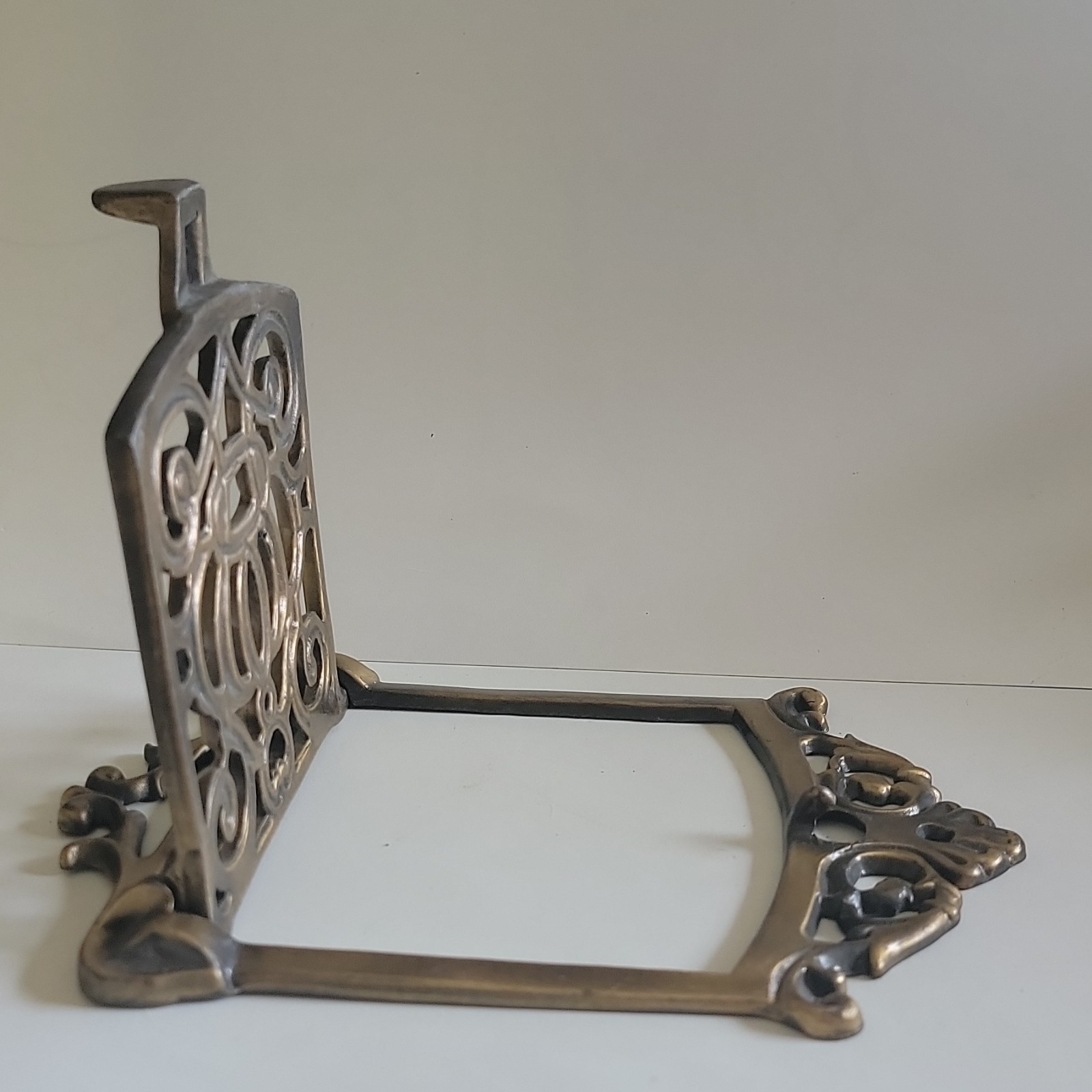 This antic ornate brass speakeasy door grille, wood-burning cookstove.