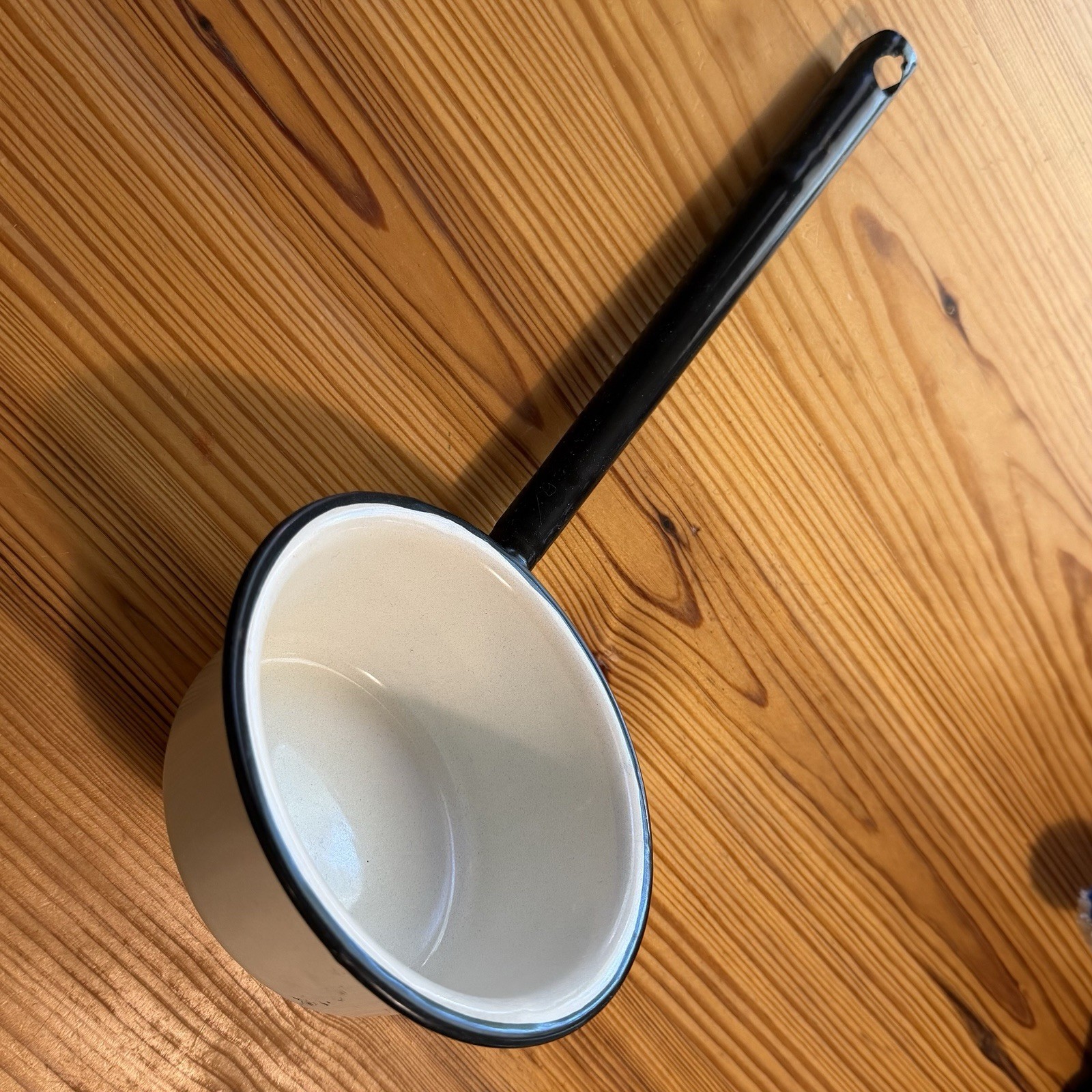 0.5 qt White Enamel-Coated Metal Saucepan, Black Rim, Long Handle