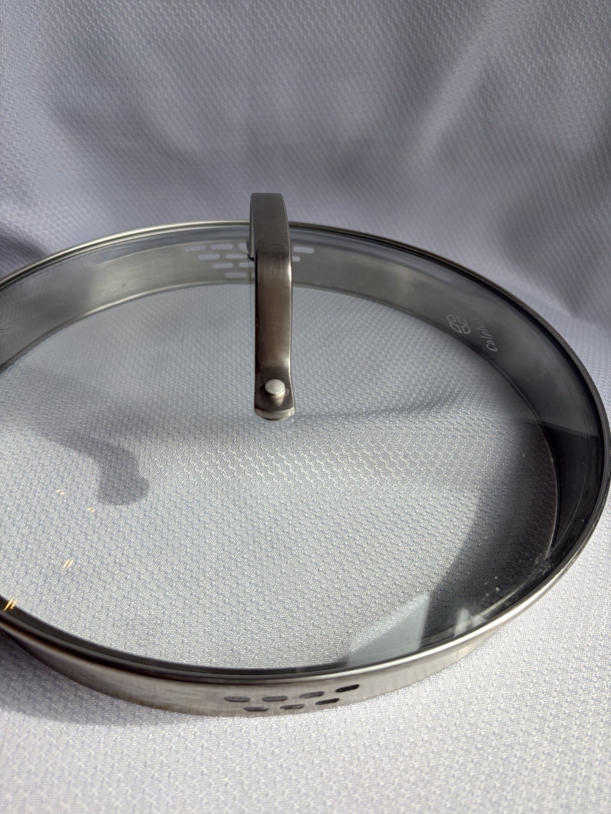 Calphalon Strainer Lid 9 3/4” Inside Diameter 10 1/2” Outside, Brushed Steel