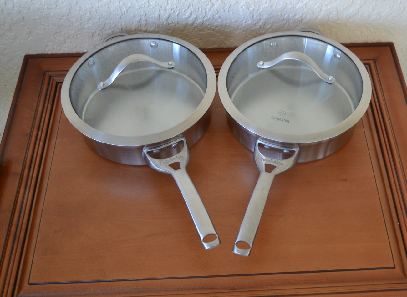 Calphalon Contemporary Stainless Steel 2 Sautepan pans with Lids and 10” Frypan