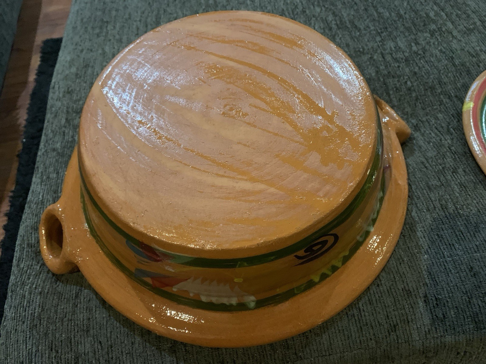 Traditional Mexican clay cazuela casserole dish feat hand-painted designs.