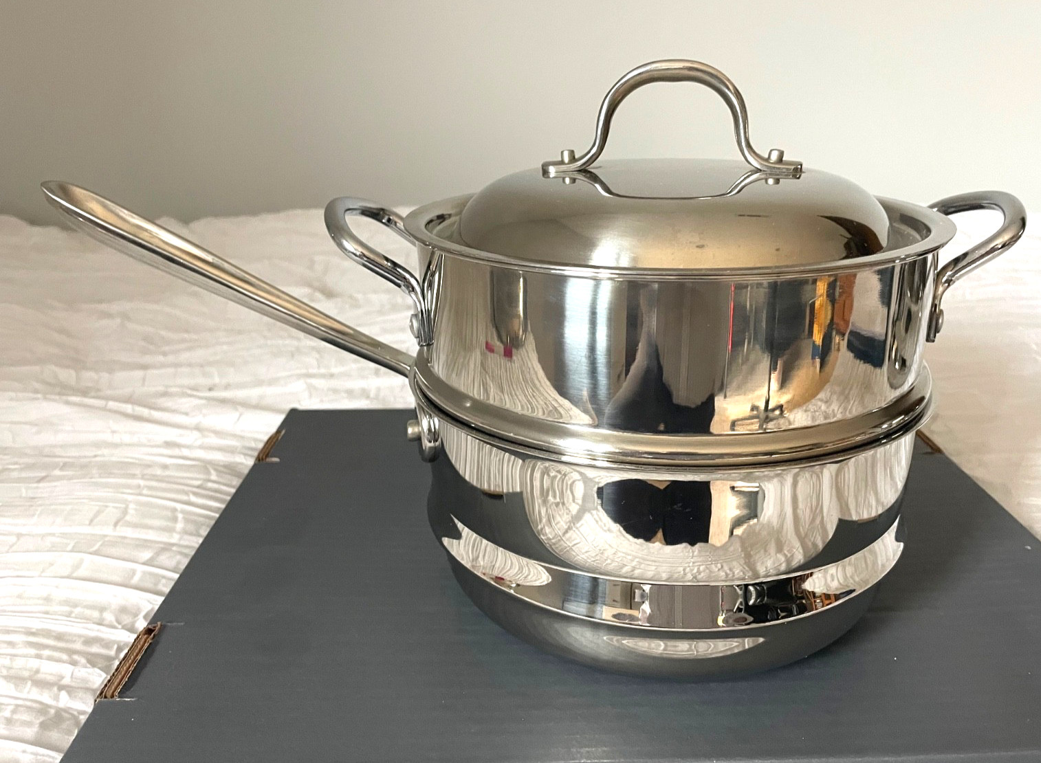 Stainless steel sauce Pan with stainless steel steamer pot and lid.
