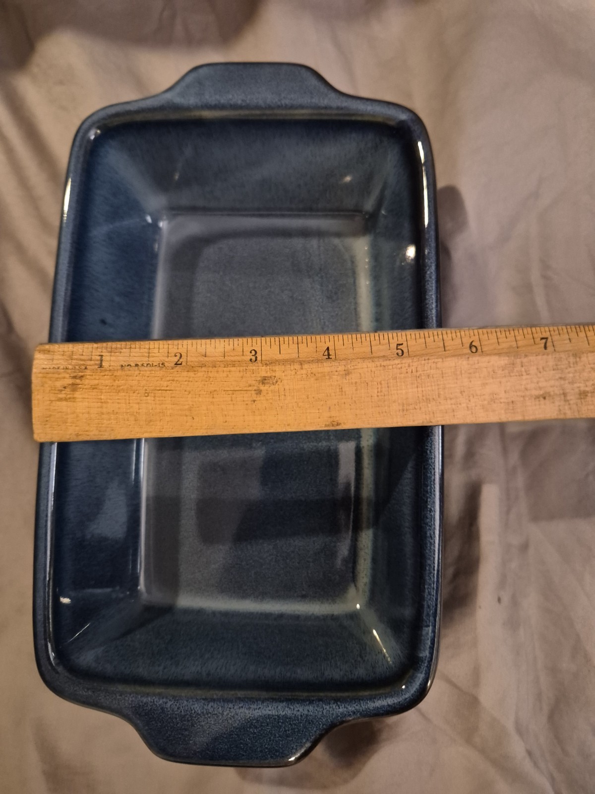 A great condition stoneware rectangular baking dish in a dark blue color 8 1/2